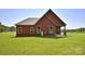 Charming home featuring a well-maintained lawn, and a quaint covered back patio at 670 Cricket Ln, Mt Ulla, NC 28125
