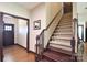 Inviting foyer with wood floors, staircase, and trim with traditional design details at 670 Cricket Ln, Mt Ulla, NC 28125