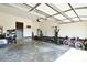 Clean and spacious two-car garage with ample storage space, interior access door, and overhead lighting at 670 Cricket Ln, Mt Ulla, NC 28125