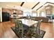 Hardwood floors in an open floor plan with a dining area and an island kitchen at 670 Cricket Ln, Mt Ulla, NC 28125