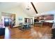 Open-concept living area with hardwood floors, dining space and modern kitchen at 670 Cricket Ln, Mt Ulla, NC 28125