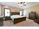 Spacious main bedroom with a tray ceiling, plush carpet, and ample natural light at 670 Cricket Ln, Mt Ulla, NC 28125