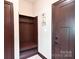 Inviting mudroom with a built-in bench, storage, and coat hooks for added convenience and organization at 670 Cricket Ln, Mt Ulla, NC 28125