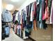 Large walk-in closet with hanging rods and shelves, perfect for organizing clothes and accessories at 670 Cricket Ln, Mt Ulla, NC 28125
