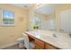 Cozy bathroom featuring a vanity with sink, a toilet, and a shower-tub combo at 7616 Shiny Meadow Ln, Charlotte, NC 28215