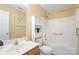 Bathroom featuring a vanity with sink, a toilet, and a shower-tub combo at 7616 Shiny Meadow Ln, Charlotte, NC 28215