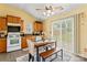 Cozy eat-in kitchen with oak cabinets and access to the backyard through sliding glass doors at 7616 Shiny Meadow Ln, Charlotte, NC 28215