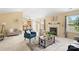 Bright living room featuring an open layout, fireplace, and an open view of the kitchen at 7616 Shiny Meadow Ln, Charlotte, NC 28215