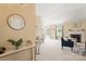An open concept living area with a fireplace, neutral paint, and a view into the dining area at 7616 Shiny Meadow Ln, Charlotte, NC 28215