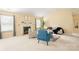Spacious living room with a fireplace, neutral paint, and plenty of natural light at 7616 Shiny Meadow Ln, Charlotte, NC 28215