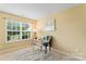 Office space features a large window, a desk, and a comfortable chair at 7616 Shiny Meadow Ln, Charlotte, NC 28215