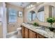 Bathroom with double sinks, granite countertop, framed art, blinds, and tile flooring at 844 Clonmel Dr, Matthews, NC 28104