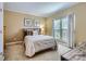 Cozy bedroom with natural light, featuring neutral tones and comfortable furnishings at 844 Clonmel Dr, Matthews, NC 28104