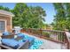 Enjoy outdoor living on this spacious deck with beautiful lake views and a comfortable seating area at 844 Clonmel Dr, Matthews, NC 28104