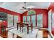 Bright dining room featuring wood floors, a large window, ceiling fan, and seating for four at 844 Clonmel Dr, Matthews, NC 28104