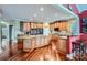 Spacious kitchen featuring granite countertops, wooden cabinets, a large island, and stainless steel appliances at 844 Clonmel Dr, Matthews, NC 28104