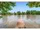 A picturesque lake view from a private dock offers a tranquil escape for residents and visitors alike at 844 Clonmel Dr, Matthews, NC 28104