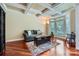 Comfortable living room with coffered ceilings, hardwood floors, large bay windows, and stylish decor at 844 Clonmel Dr, Matthews, NC 28104