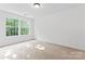 Bedroom featuring two windows for natural light and a neutral color scheme, creating a serene atmosphere at 9833 White Cascade Dr, Charlotte, NC 28269