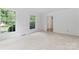 Light-filled room with carpet flooring and two large windows, freshly painted and move-in ready at 9833 White Cascade Dr, Charlotte, NC 28269