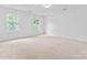 Carpeted bedroom with two windows overlooking greenery, neutral paint and move-in ready at 9833 White Cascade Dr, Charlotte, NC 28269