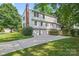 View of the back of the house featuring white siding and a two-car garage at 9833 White Cascade Dr, Charlotte, NC 28269