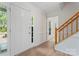 Bright foyer with hardwood floors and a staircase at 9833 White Cascade Dr, Charlotte, NC 28269