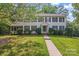 Charming two-story home featuring manicured landscaping, a walkway, and a welcoming entrance at 9833 White Cascade Dr, Charlotte, NC 28269