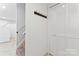 View of hallway with access to washer/dryer hookup and closet with white bi-fold doors at 9833 White Cascade Dr, Charlotte, NC 28269