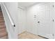 Bright hallway with tile floor and white doors leading to other rooms at 9833 White Cascade Dr, Charlotte, NC 28269