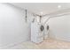 Spacious laundry area with tile flooring, washer and dryer hookups and freshly painted walls at 9833 White Cascade Dr, Charlotte, NC 28269