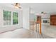 Bright and airy living room featuring a fireplace, built-in shelving and large windows at 9833 White Cascade Dr, Charlotte, NC 28269