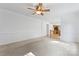 Living room has neutral colors, crown molding, and an open layout to other rooms at 9833 White Cascade Dr, Charlotte, NC 28269
