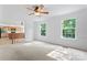 Living room is open to the kitchen and has large windows letting in natural light at 9833 White Cascade Dr, Charlotte, NC 28269
