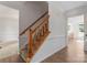 Staircase with wooden banister and hardwood flooring at 9833 White Cascade Dr, Charlotte, NC 28269