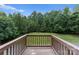 Enjoy the outdoors on this deck overlooking a lush, wooded backyard for peaceful relaxation at 10094 Treeside Ln, Matthews, NC 28105