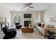 Comfortable living room featuring a fireplace, French doors to the deck, and neutral decor at 10094 Treeside Ln, Matthews, NC 28105