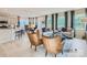 Open-concept living space featuring a kitchen island, dining area, and cozy seating, ideal for modern living and entertaining at 1020 Lookout Shoals Dr, Fort Mill, SC 29715
