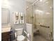Accessible bathroom with a modern glass shower, grab bars and well-placed fixtures at 10818 Alvarado Way, Charlotte, NC 28277