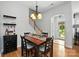 Charming dining area featuring stylish lighting and an inviting view of the entrance at 10818 Alvarado Way, Charlotte, NC 28277