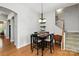 Cozy dining room with a staircase view, perfect for Gathering meals and entertaining guests at 10818 Alvarado Way, Charlotte, NC 28277