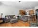 Spacious living room with comfortable seating, connected to the kitchen area, ideal for entertaining at 10818 Alvarado Way, Charlotte, NC 28277
