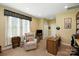 Bright and airy living room with a comfortable armchair and plenty of natural light at 10818 Alvarado Way, Charlotte, NC 28277