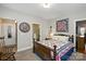 Comfortable bedroom with a unique quilt and easy access to the bathroom and closet at 10818 Alvarado Way, Charlotte, NC 28277