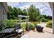 Relaxing patio area includes seating, fire pit, pergola, and lush greenery at 10818 Alvarado Way, Charlotte, NC 28277