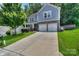 Beautiful two-story home with a two car garage and well-manicured lawn at 113 Missouri Ln, Mount Holly, NC 28120