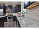 Updated kitchen boasts granite counters, stainless appliances, and subway tile backsplash at 113 Missouri Ln, Mount Holly, NC 28120