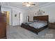 Spacious main bedroom featuring soft carpet, neutral paint and tray ceiling at 113 Missouri Ln, Mount Holly, NC 28120