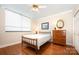 Bedroom with hardwood floors, a ceiling fan and natural light at 1300 Reece Rd # 402, Charlotte, NC 28209