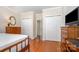 Comfortable bedroom showcasing hardwood floors, closet space, and neutral paint at 1300 Reece Rd # 402, Charlotte, NC 28209